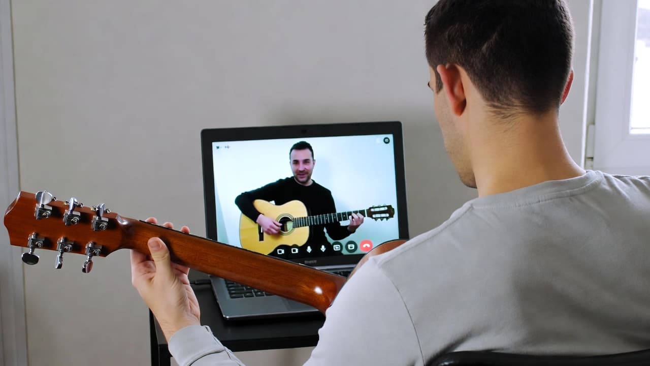 Virtual guitar lesson on a video call